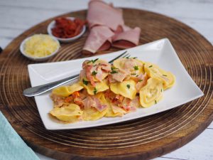 10 Minute Creamy Cheese Ravioli with Ham and Sun Dried Tomatoes