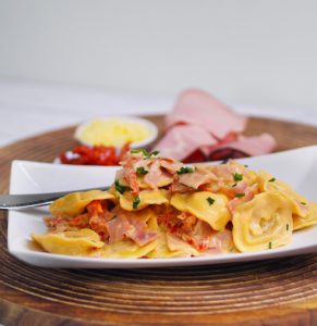 10 Minute Creamy Cheese Ravioli with Ham and Sun Dried Tomatoes